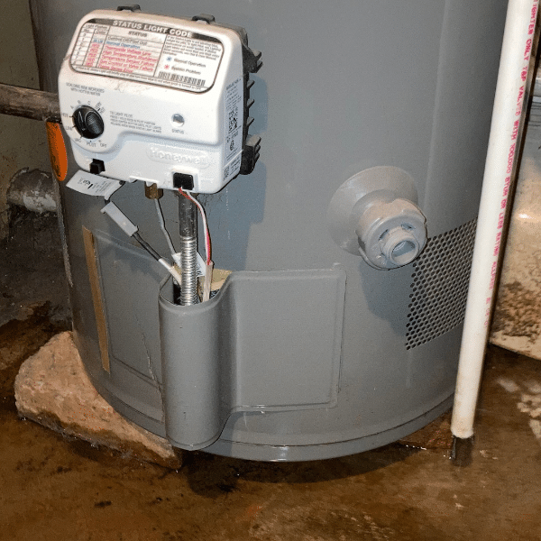 Picture of a water heater with a leak